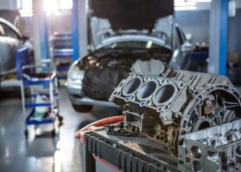 Close-up of car parts in repair garage